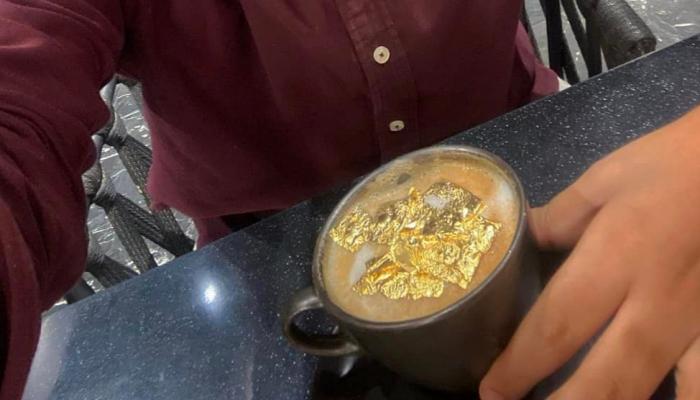 197-014746-young-man-drinking-cappuccino-gold_700x400