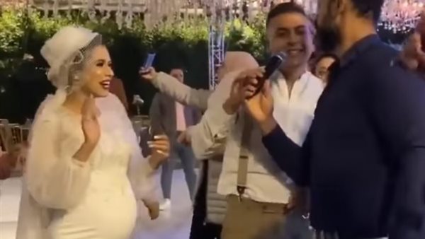 صاحب جلسة التصوير يكشف سر العروس الحامل.. حكاية حفل زفاف أغضب السوشيال ميديا | شاهد