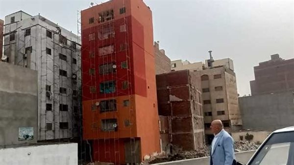 سر طلاء عمارات الدائري باللونين البيج والبرتقالي